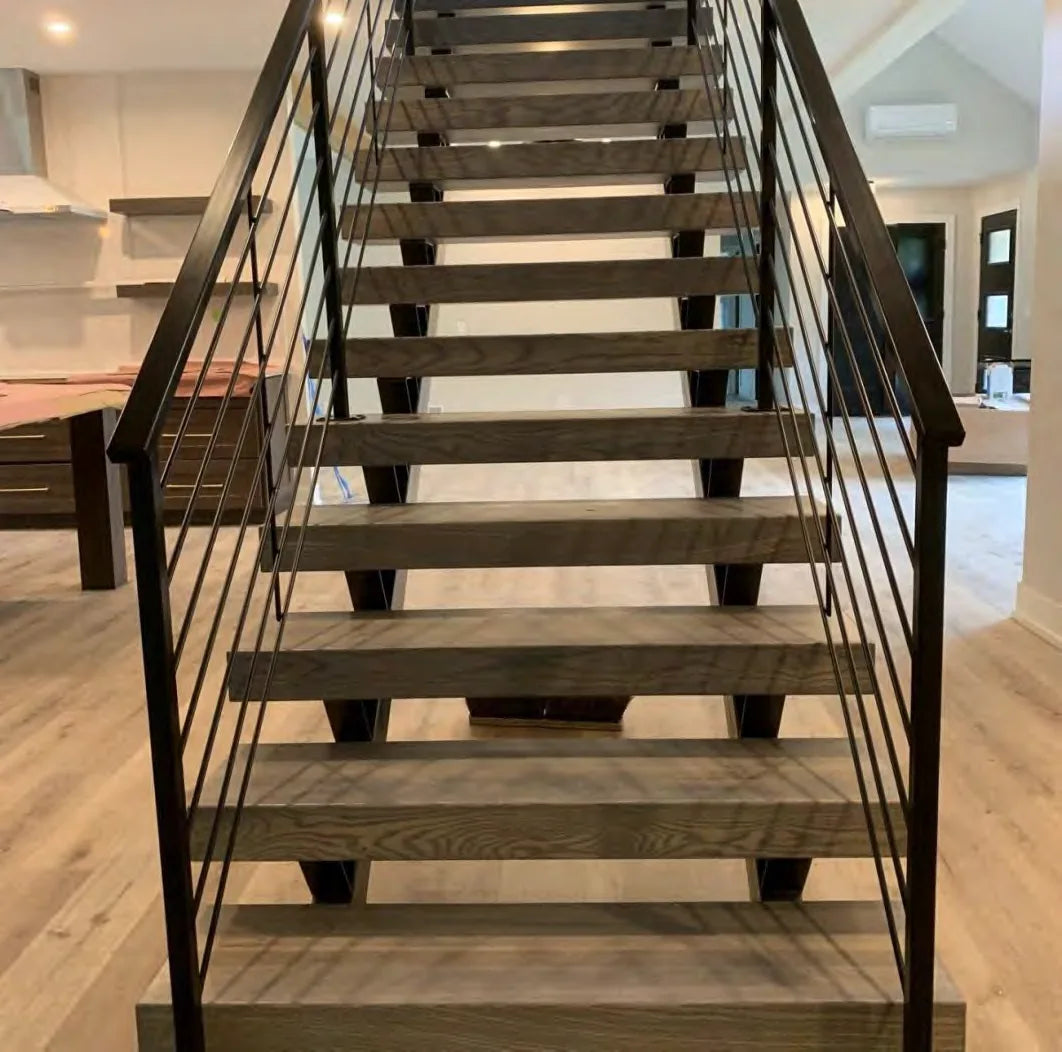 Open-riser stair project with wood treads and metal railing